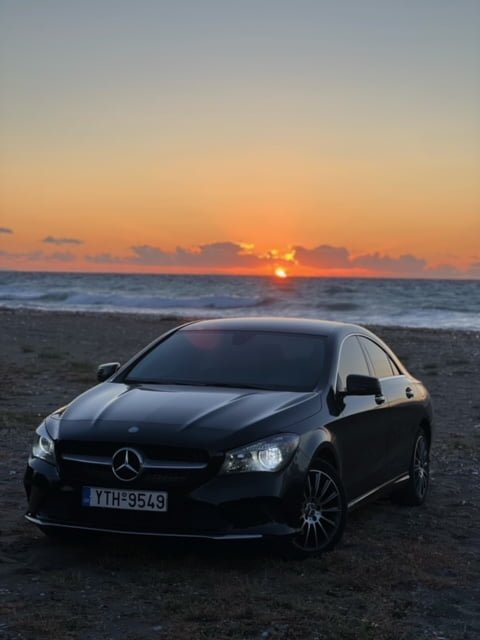 mercedes benz cla 180d before a sunset at beach